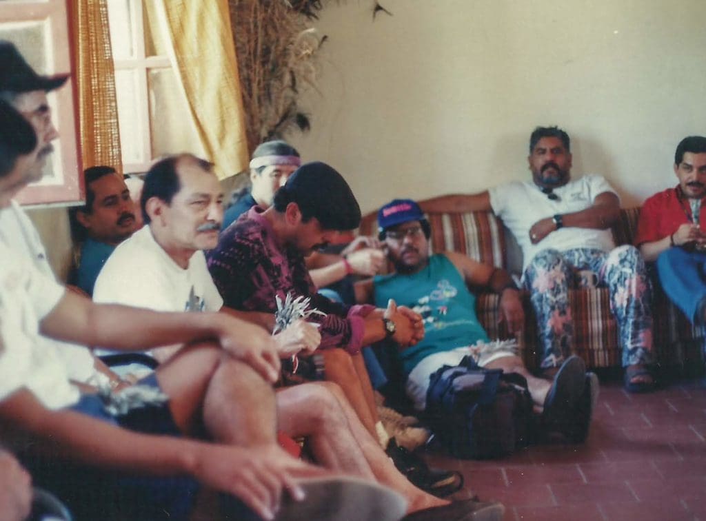 Group of men sitting in chairs and chilling
