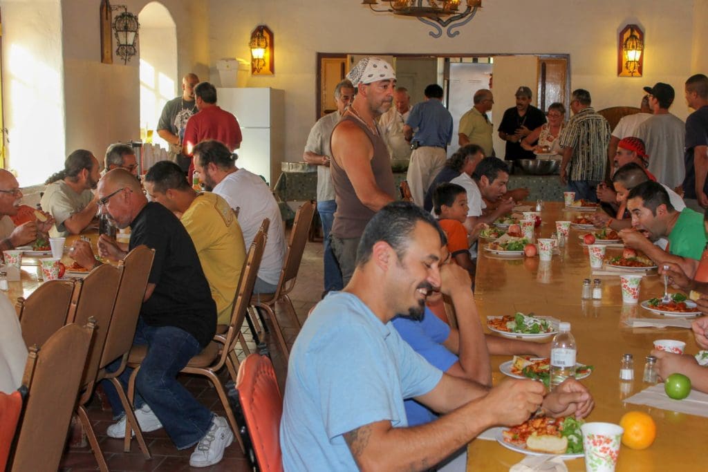 Group of men having their food in the dining area